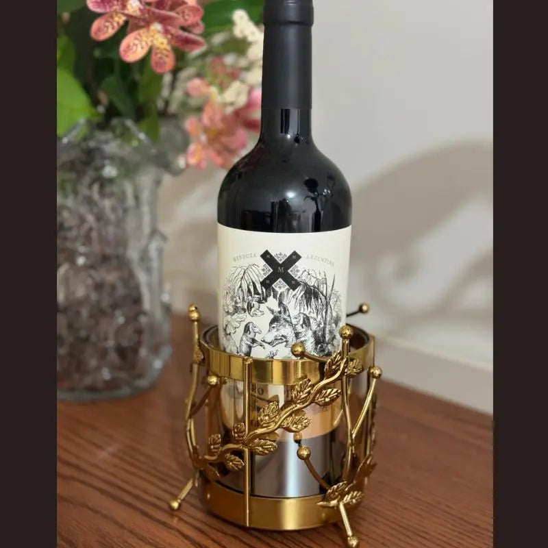 Majestic Wine Bottle Holder — elegant metal and glass design for wine bottles and table décor. Modern accessory by Trustique.