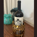 Majestic Wine Bottle Holder — elegant metal and glass design for wine bottles and table décor. Modern accessory by Trustique.