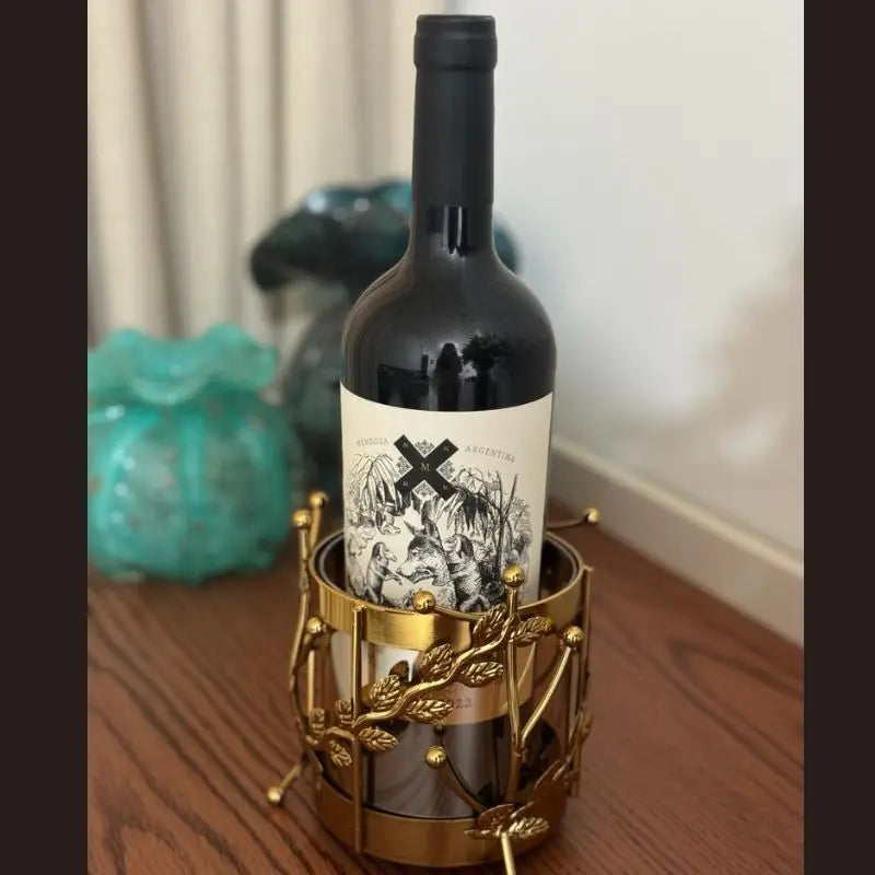 Majestic Wine Bottle Holder — elegant metal and glass design for wine bottles and table décor. Modern accessory by Trustique.