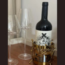 Majestic Wine Bottle Holder — elegant metal and glass design for wine bottles and table décor. Modern accessory by Trustique.