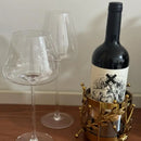 Majestic Wine Bottle Holder — elegant metal and glass design for wine bottles and table décor. Modern accessory by Trustique.